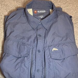 Simms fishing guide series long sleeve button blue shirt.